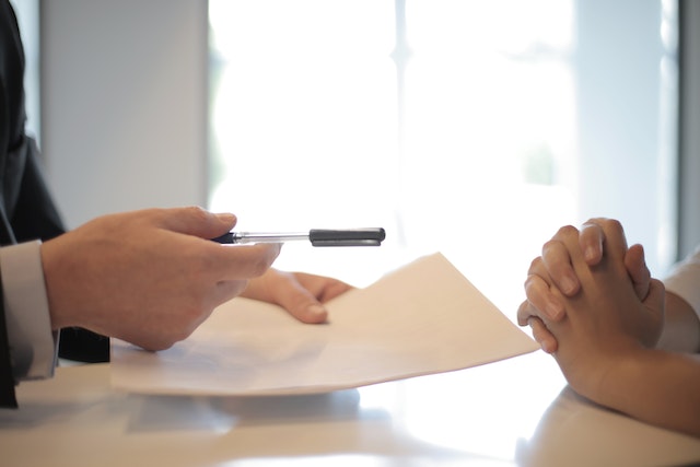people exchanging documents