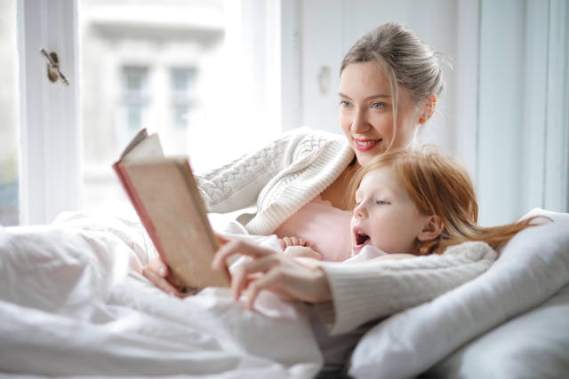 mother and child reading together