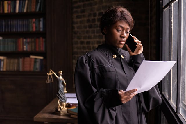 judge on phone looking at paper