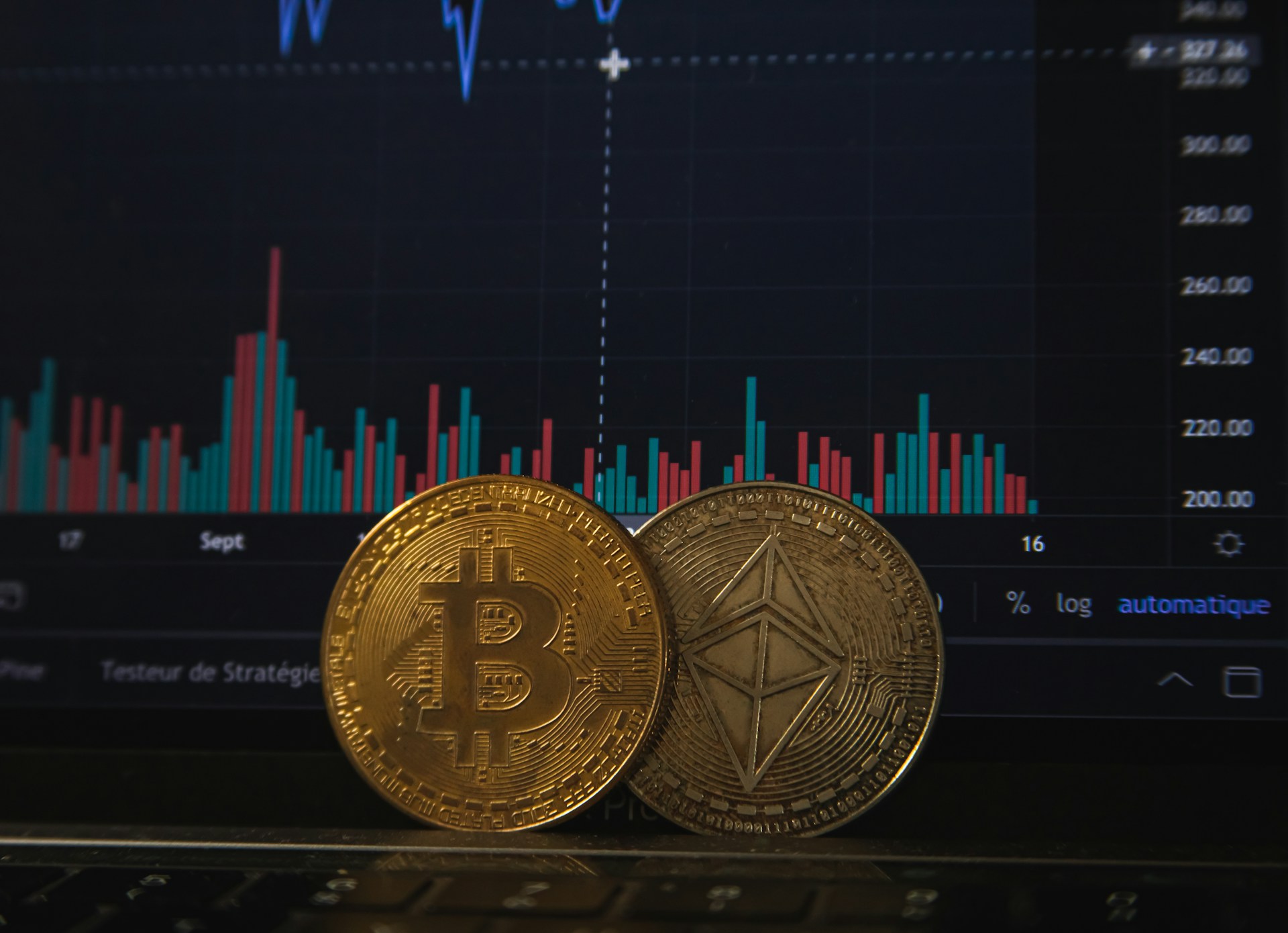 bitcoins in front of computer screen